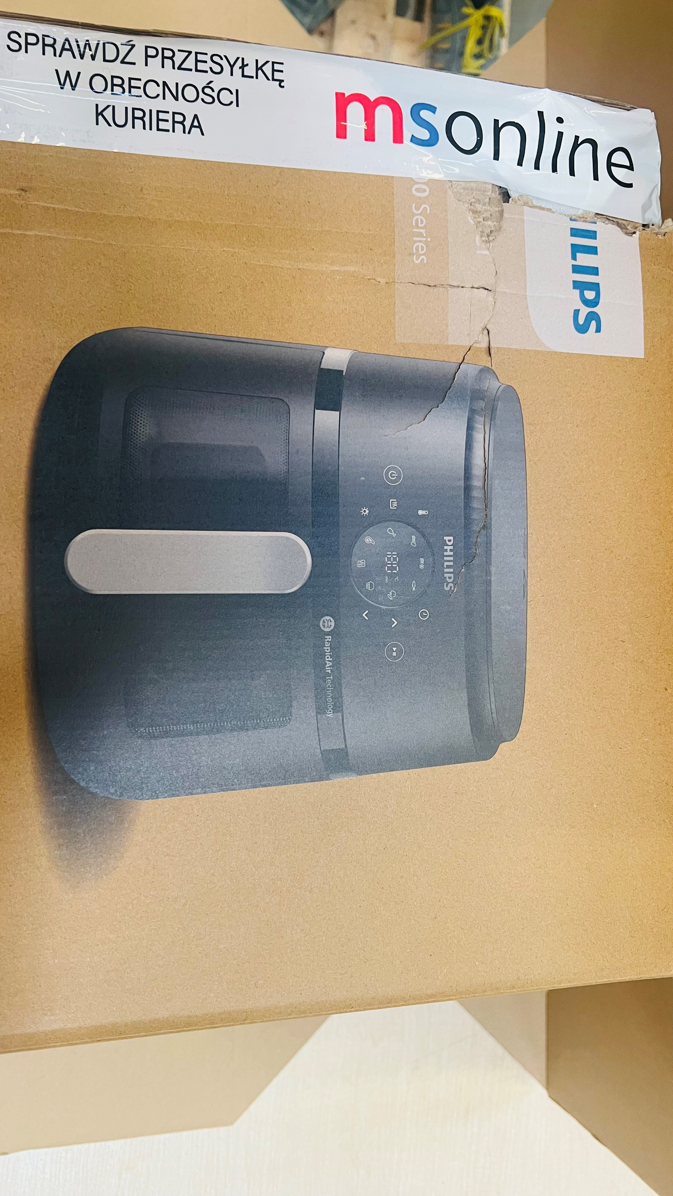 Obraz to pudełko Philips Airfryer. Pudełko zawiera tekst w języku polskim i zdjęcie produktu.