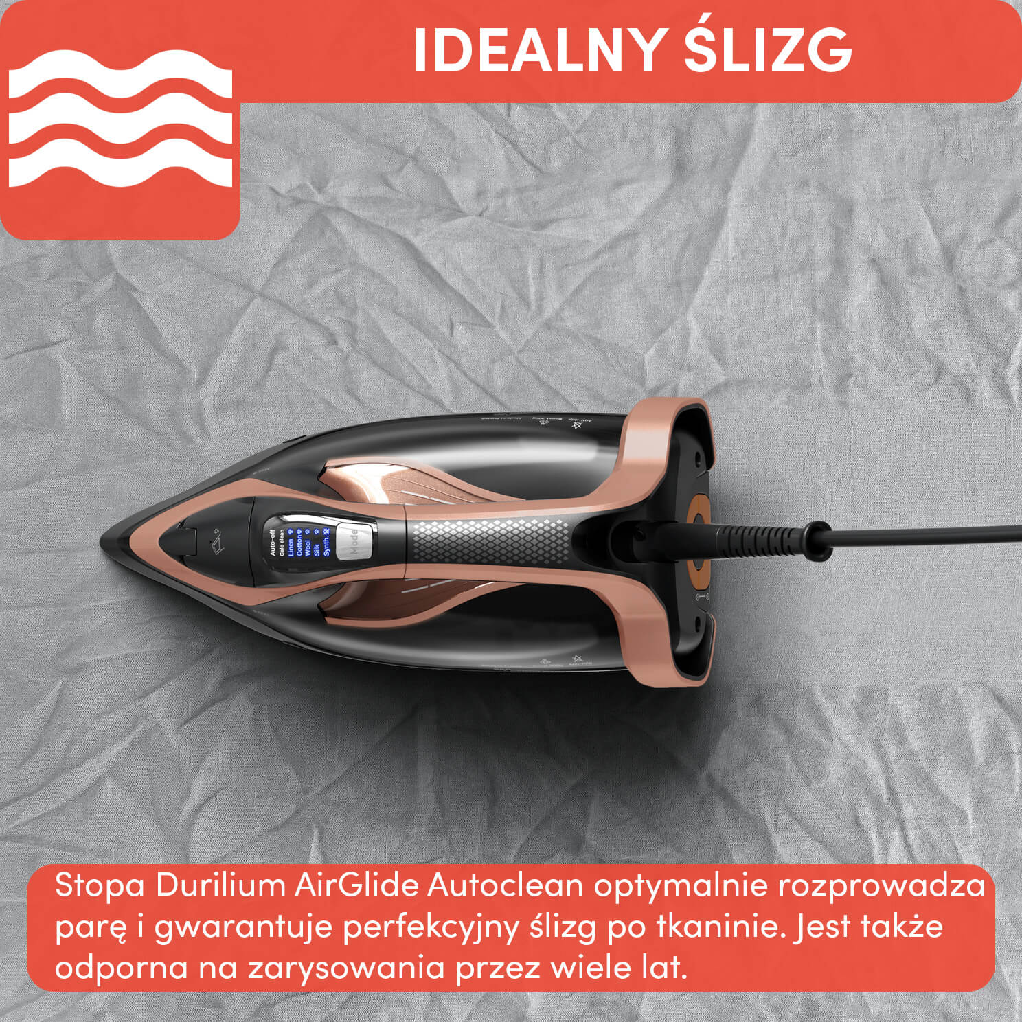 Żelazko z różowego złota i czarnym designem, umieszczone na białej powierzchni. Żelazko jest włączone.