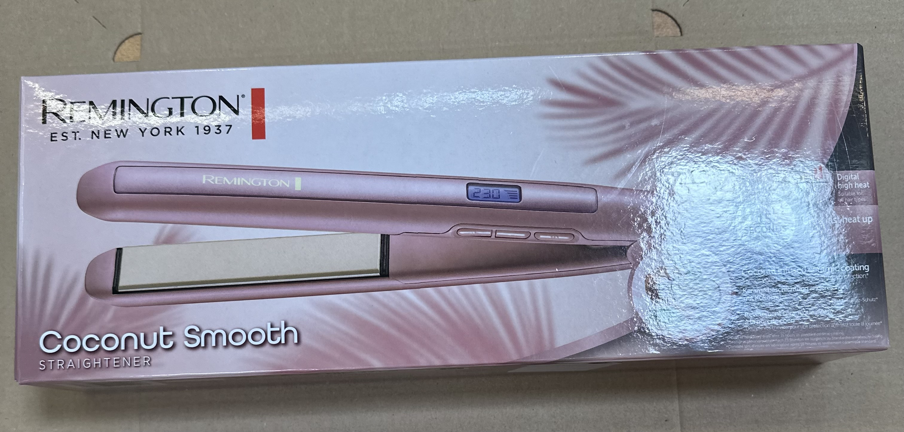 Pudełko prostownicy Remington Coconut Smooth. Różowy design, szczegóły produktu i tekst.