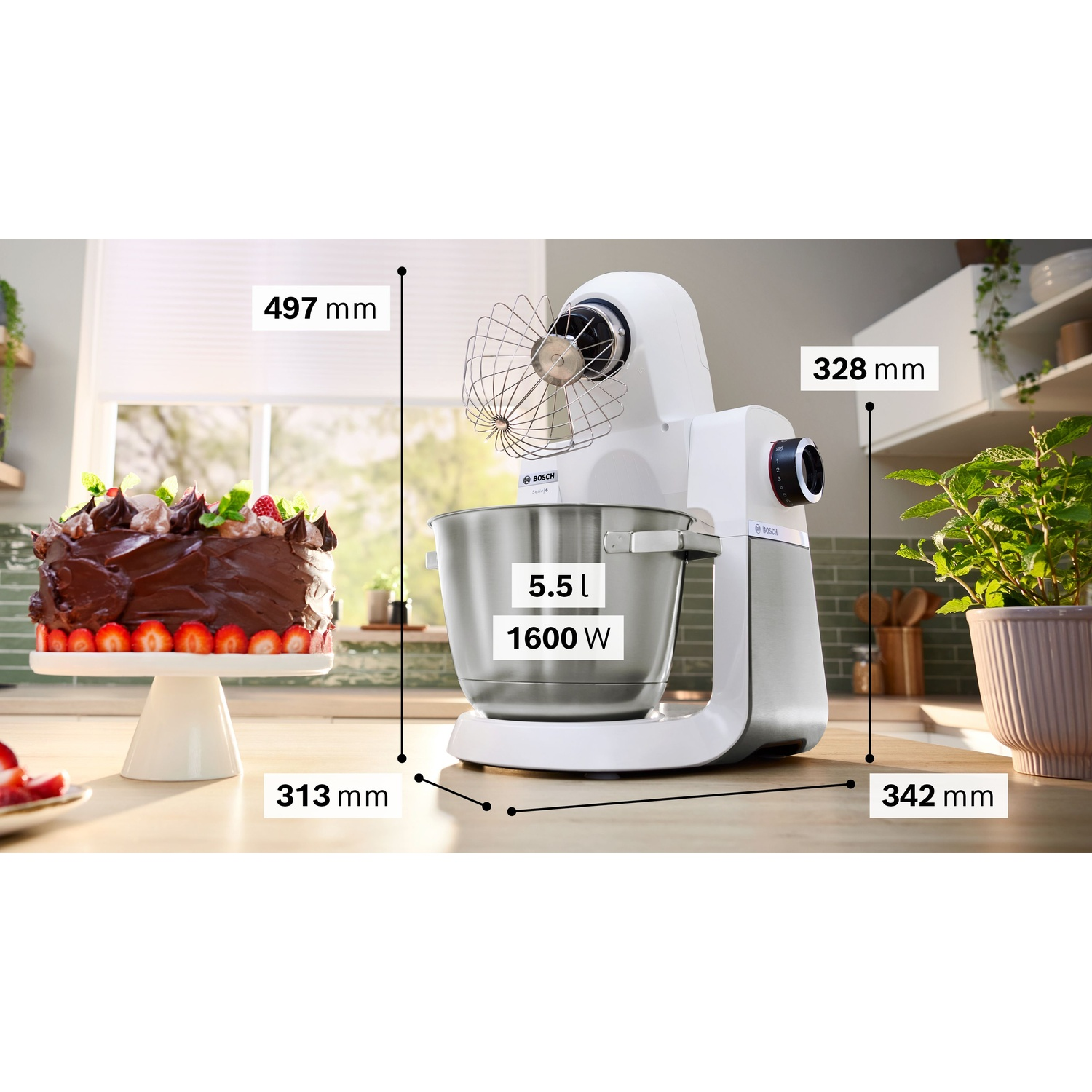 Elettrodomestico da cucina bianco con dimensioni, ingredienti e torta sullo sfondo.