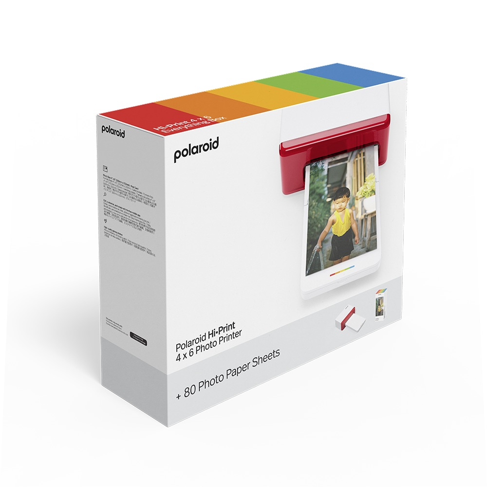Yanında bir fotoğraf yazıcısı bulunan Polaroid Hi-Print kutusu. Kutunun gökkuşağı şeridi var.