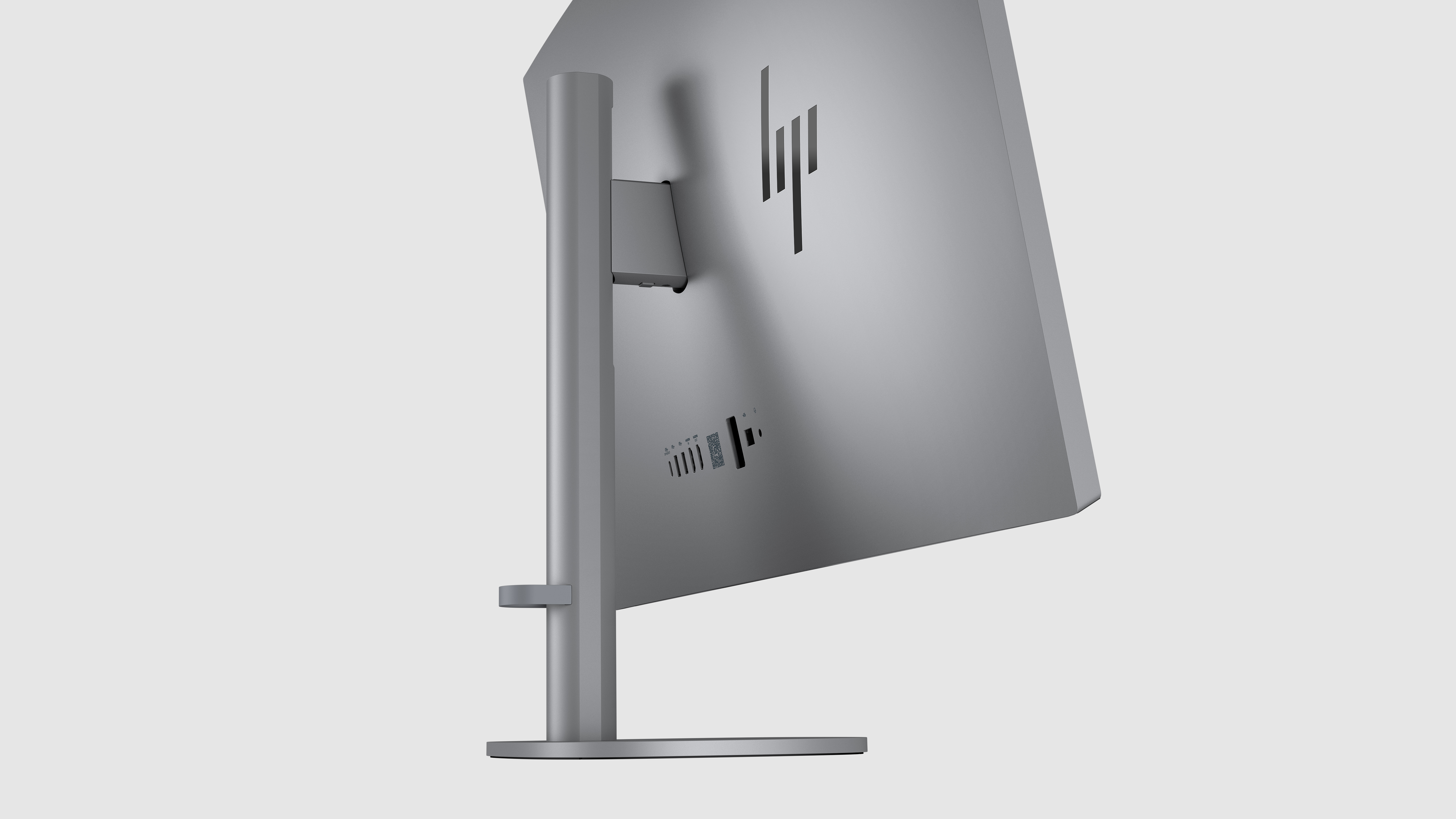 Rückansicht eines HP-Monitors. Silber, mit HP-Logo. Anschlüsse sind sichtbar.