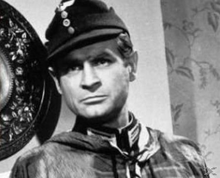 Schwarz-Weiß-Foto eines Mannes in Militäruniform mit Hut. Er schaut nach vorne.