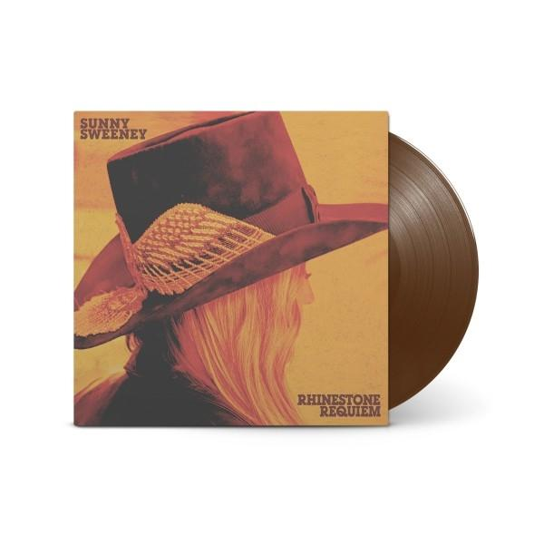 Albumcover: blonde Frau mit Hut, mit brauner Vinyl-Schallplatte.