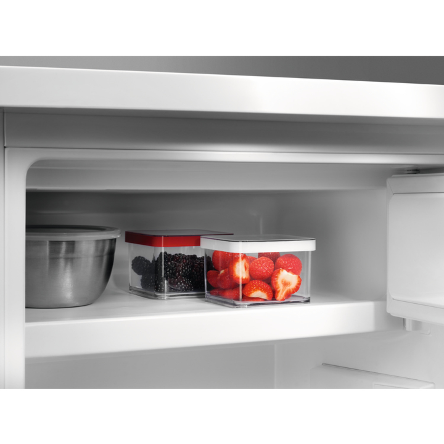 Refrigerator interior with containers of food.