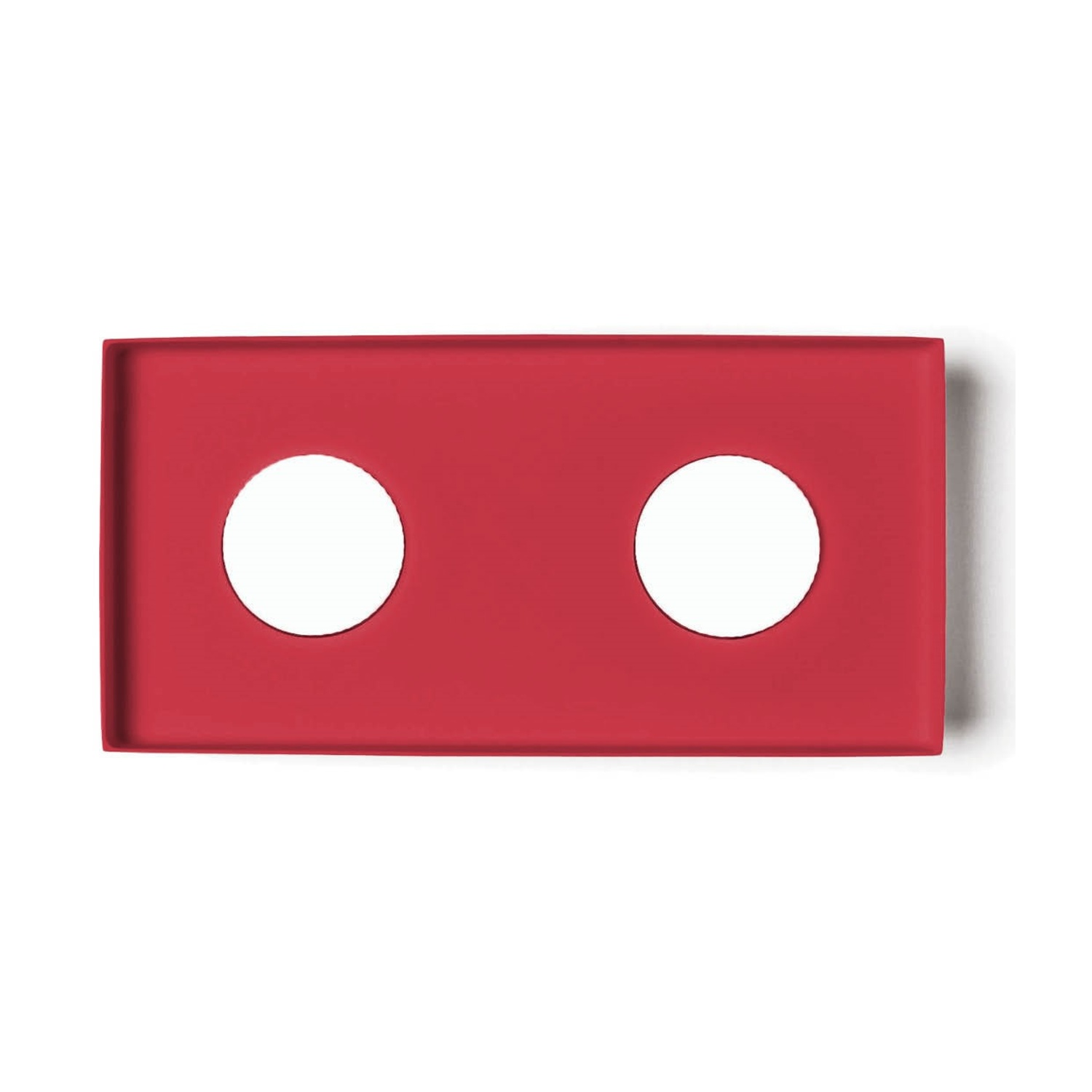 Apparecchio di illuminazione rettangolare rosso con due fori circolari su sfondo bianco, che proietta ombre.
