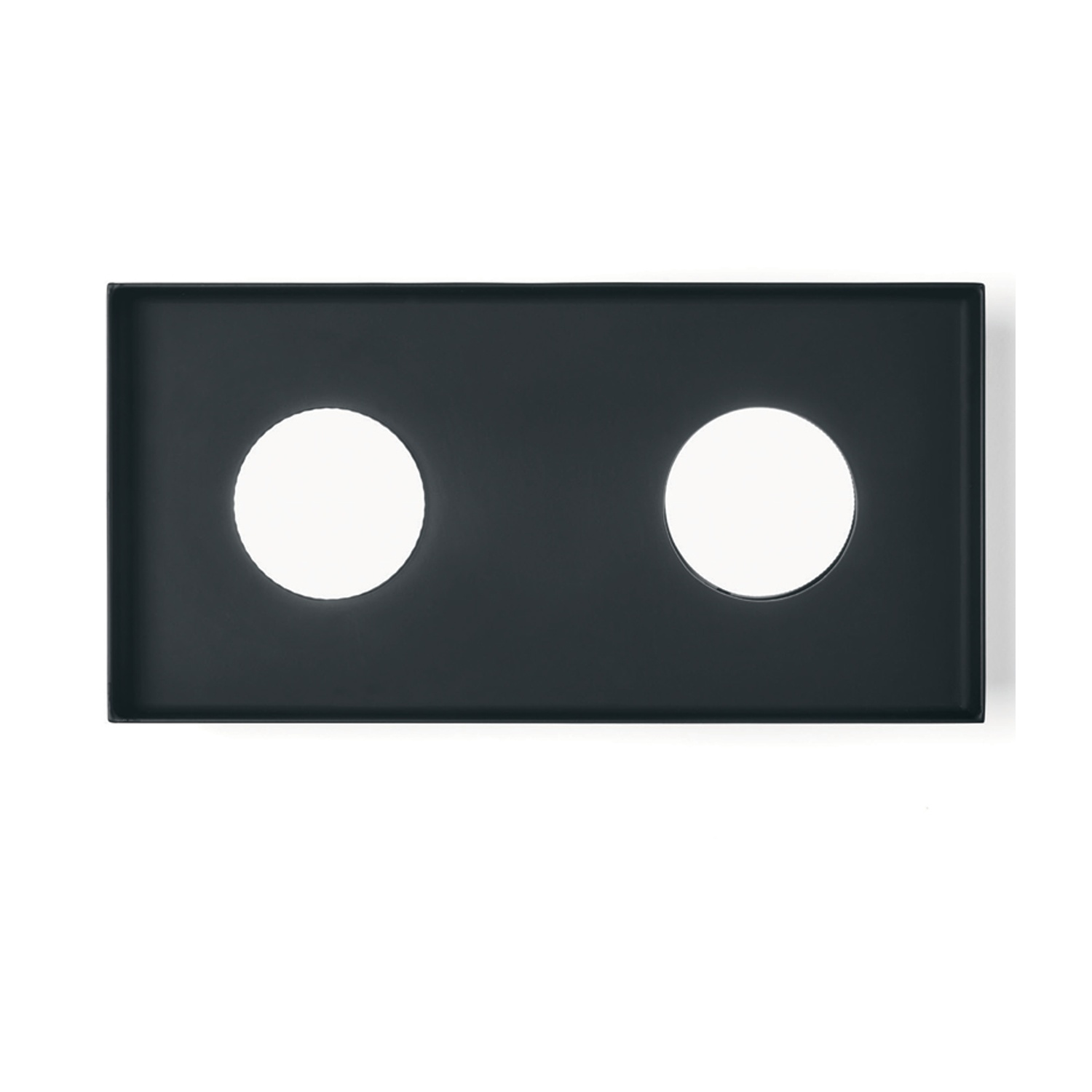 Apparecchio rettangolare nero con due luci circolari. Sfondo bianco. Design semplice e moderno.