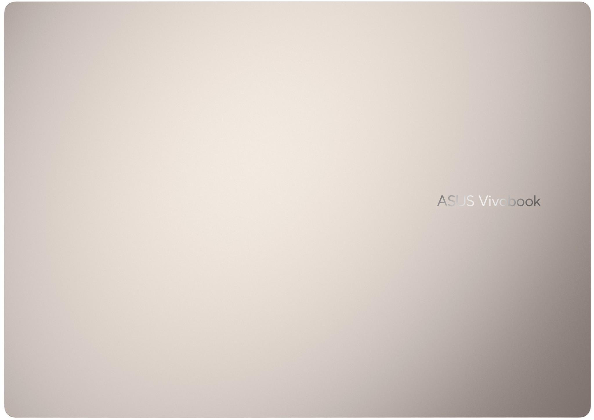 A laptop felülnézete, bézs színű, ASUS Vivobook felirattal.