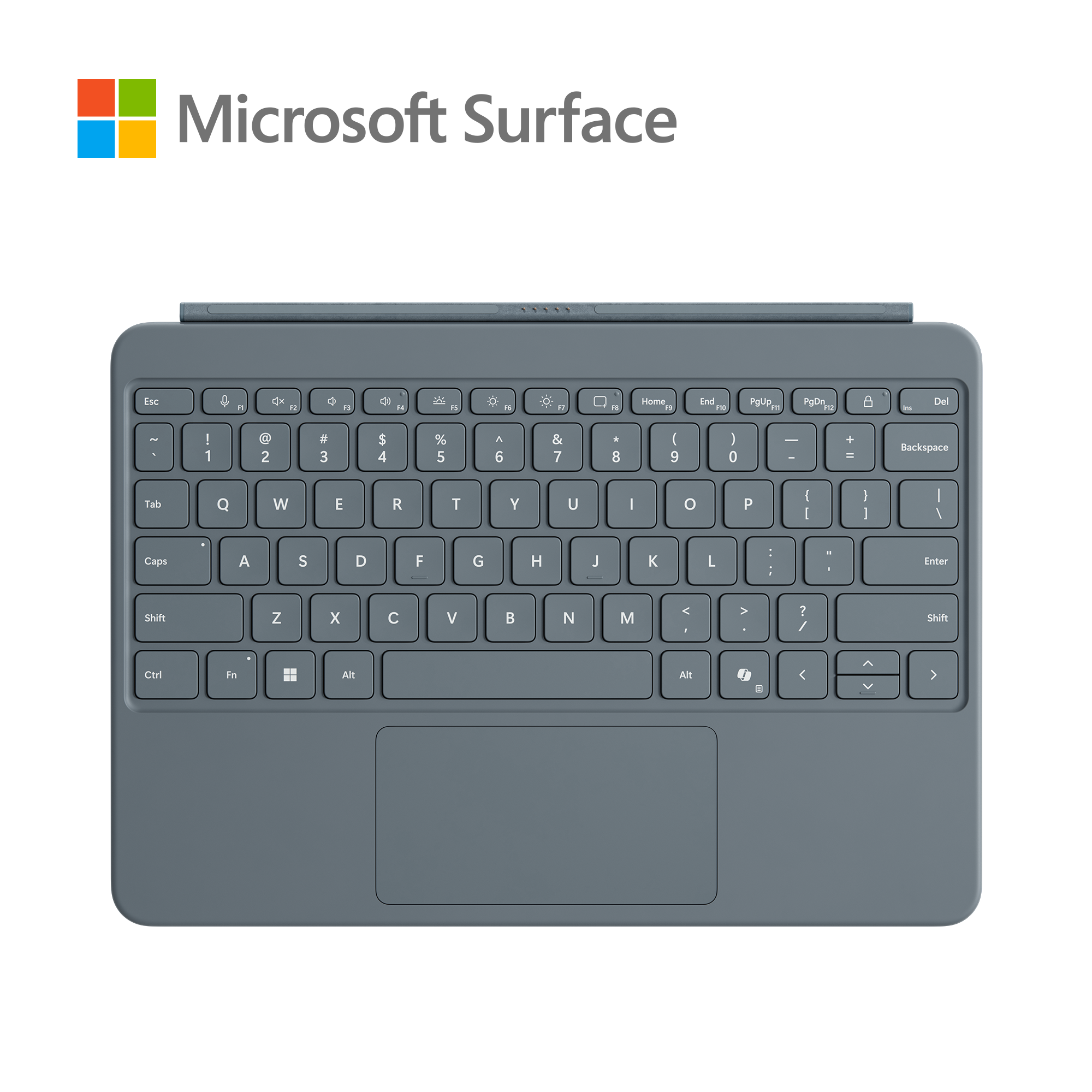 Un teclado gris claro con un panel táctil negro. El logotipo de Microsoft está en la esquina superior izquierda.