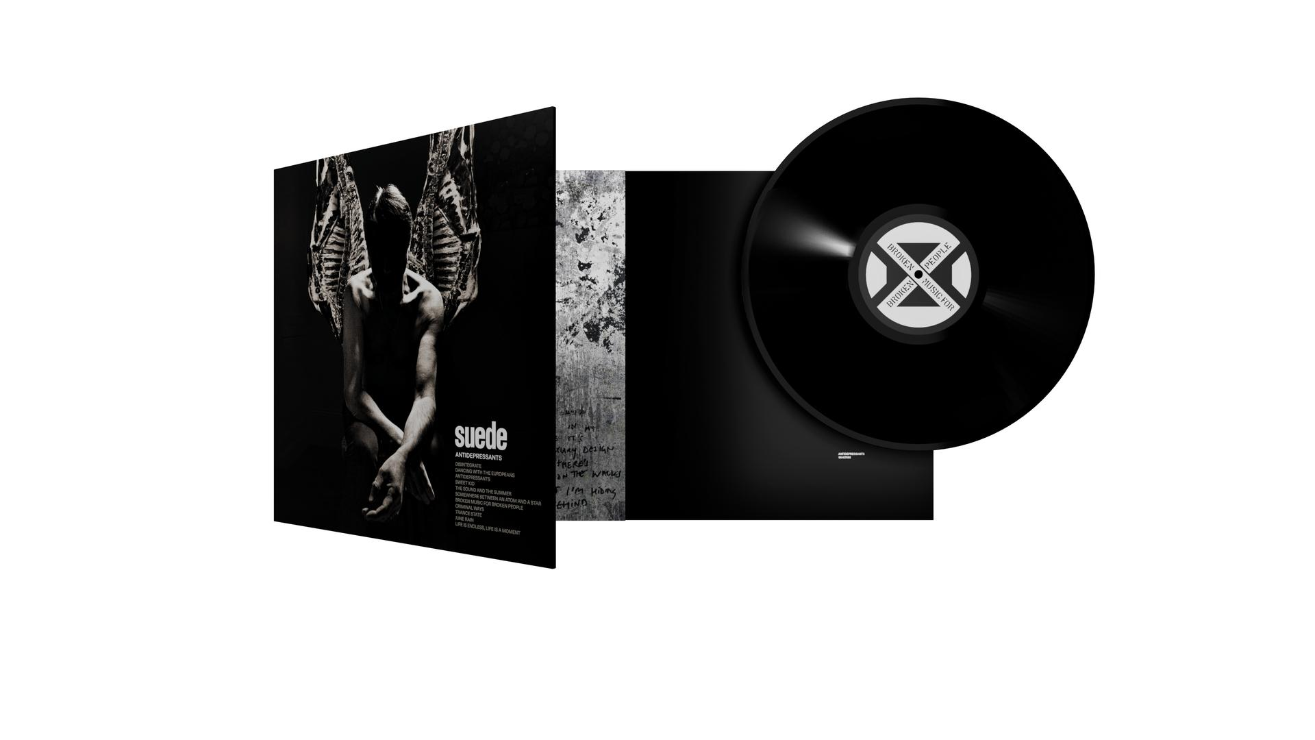 Vinyl-Schallplattenalbum geöffnet. Cover mit Figur und Text. Schwarze Vinyl-Disc.