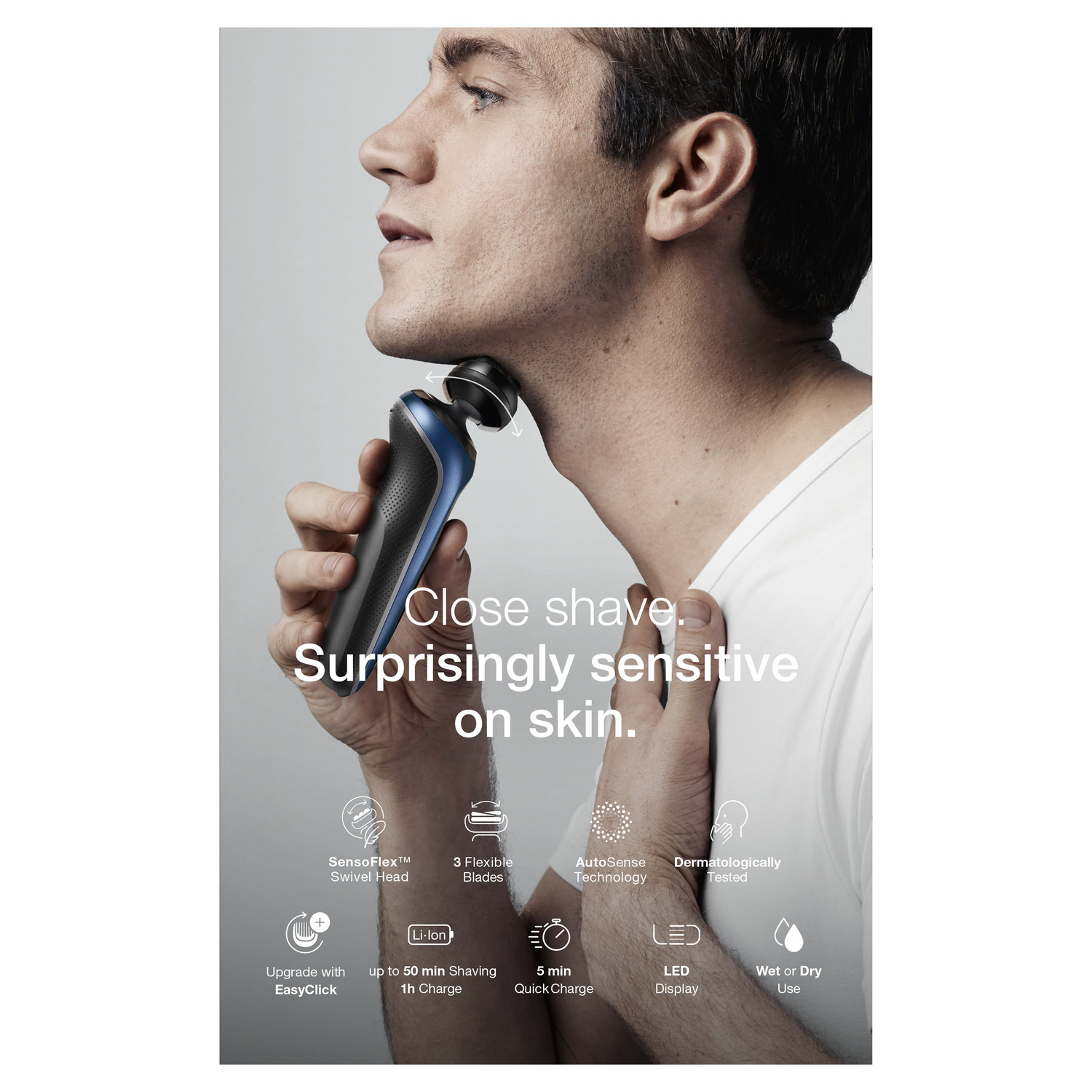 A man shaves his neck with an electric razor.