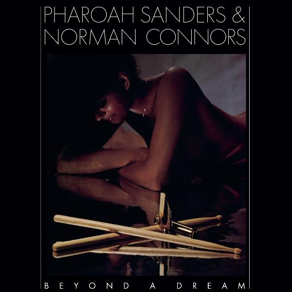 Albumcover mit nackter Person, Schlagzeugstöcken und Text 'Beyond a Dream'.