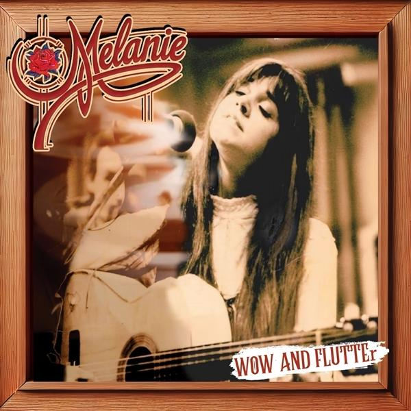 Albumcover, Frau mit Gitarre, Holzrahmen und Rosenlogo.