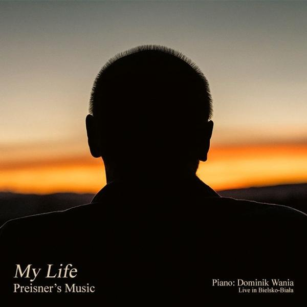 Eine Silhouette des Rückens eines Mannes vor einem Sonnenuntergang. Text: 'My Life' und 'Preisner's Music' stehen unten.