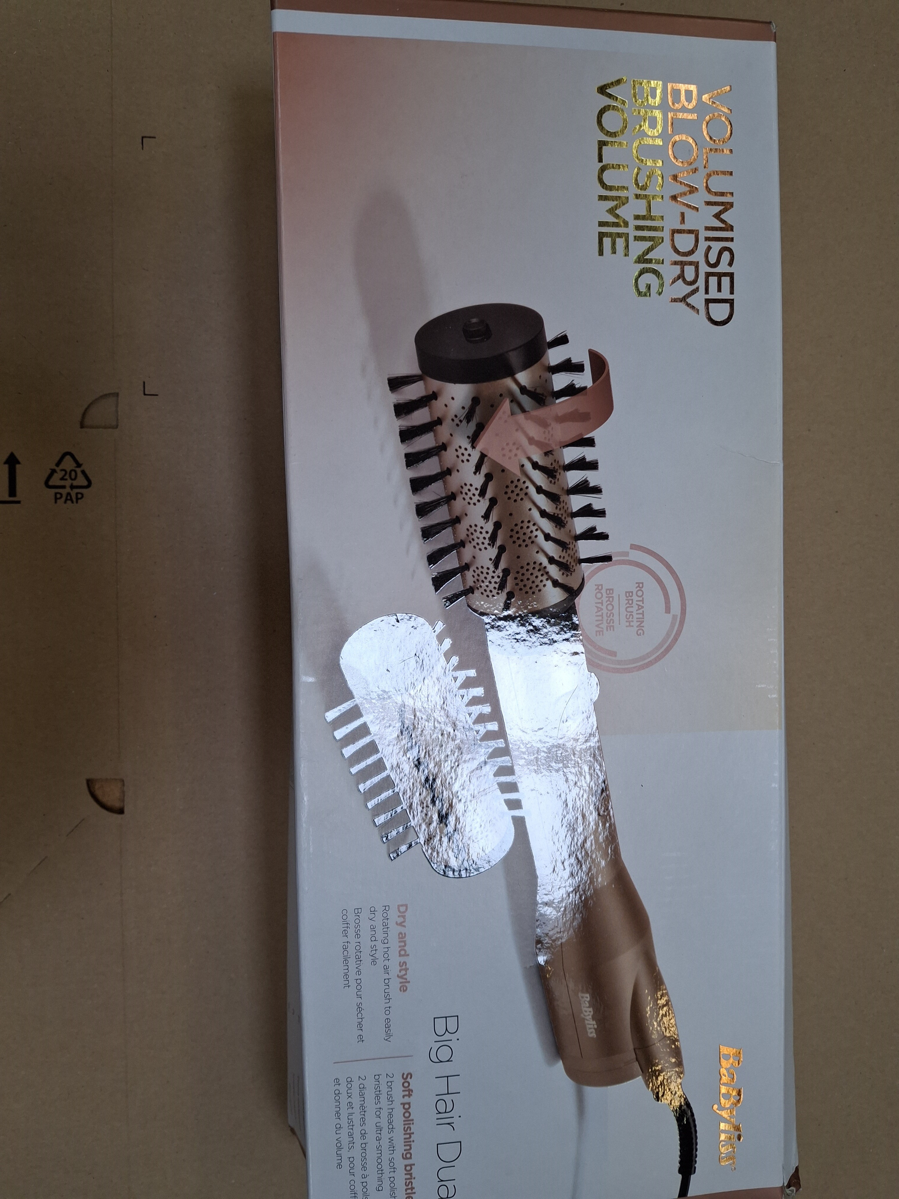 Zapakowane narzędzie do stylizacji włosów. Pudełko pokazuje produkt z napisem 'Volumised Blow-Dry'.