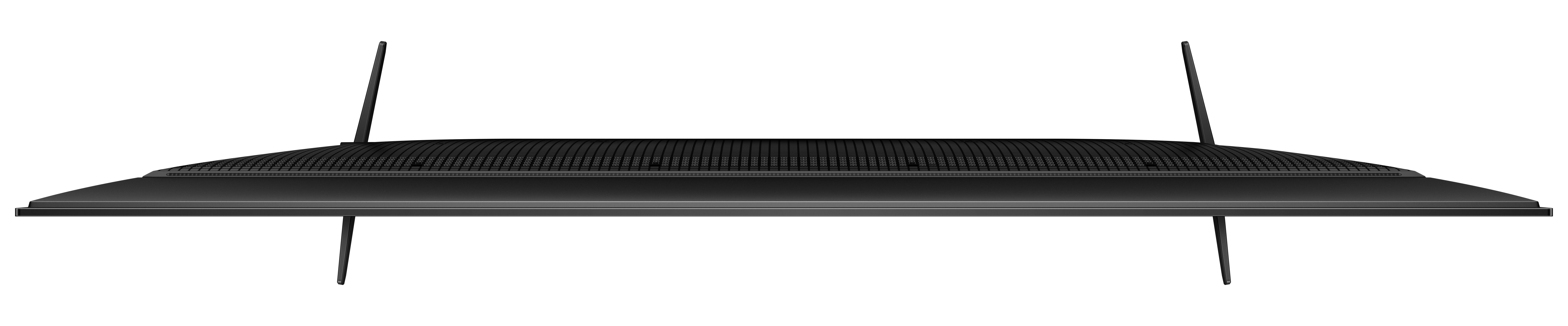 Téléviseur noir, vue de dessus. Deux pieds sont visibles. Le dessus a une grille de haut-parleur.