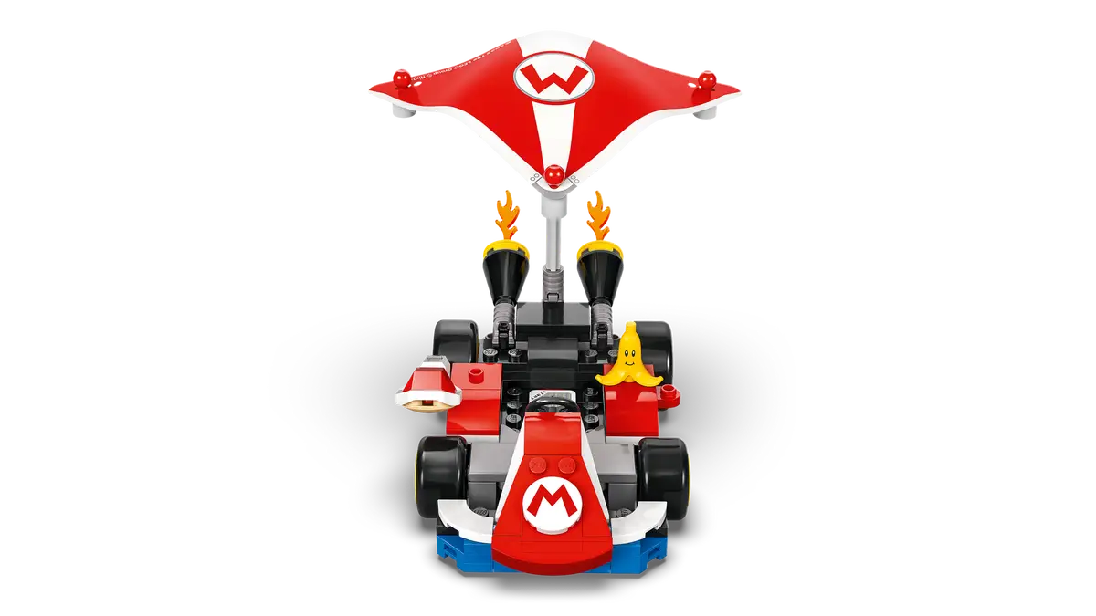 Lego Mario Kart: Czerwony i biały kart z bananem, czerwonym i białym parasolem, czarne tło.