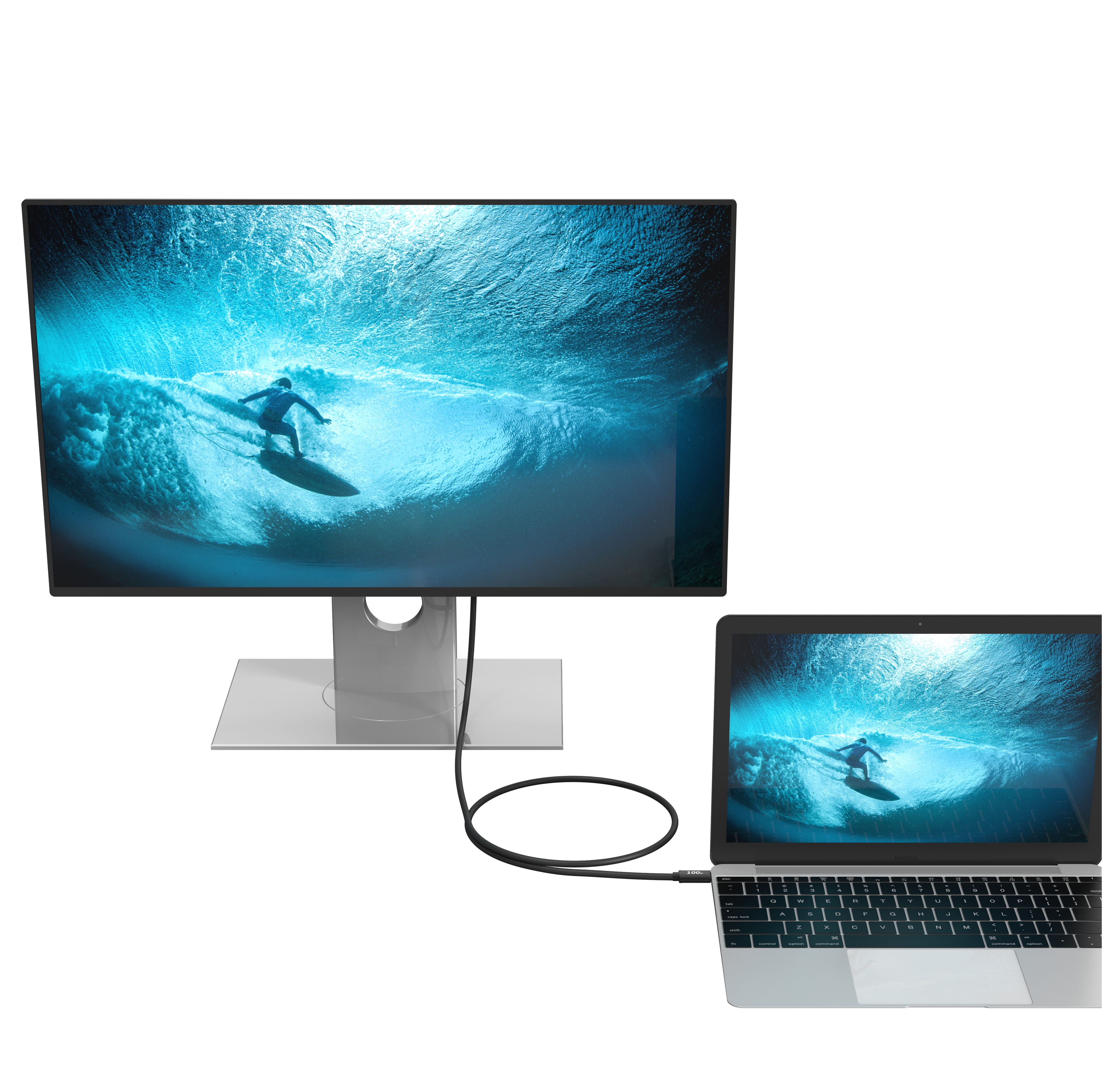 Monitor i laptop wyświetlają surfera na fali pod wodą.