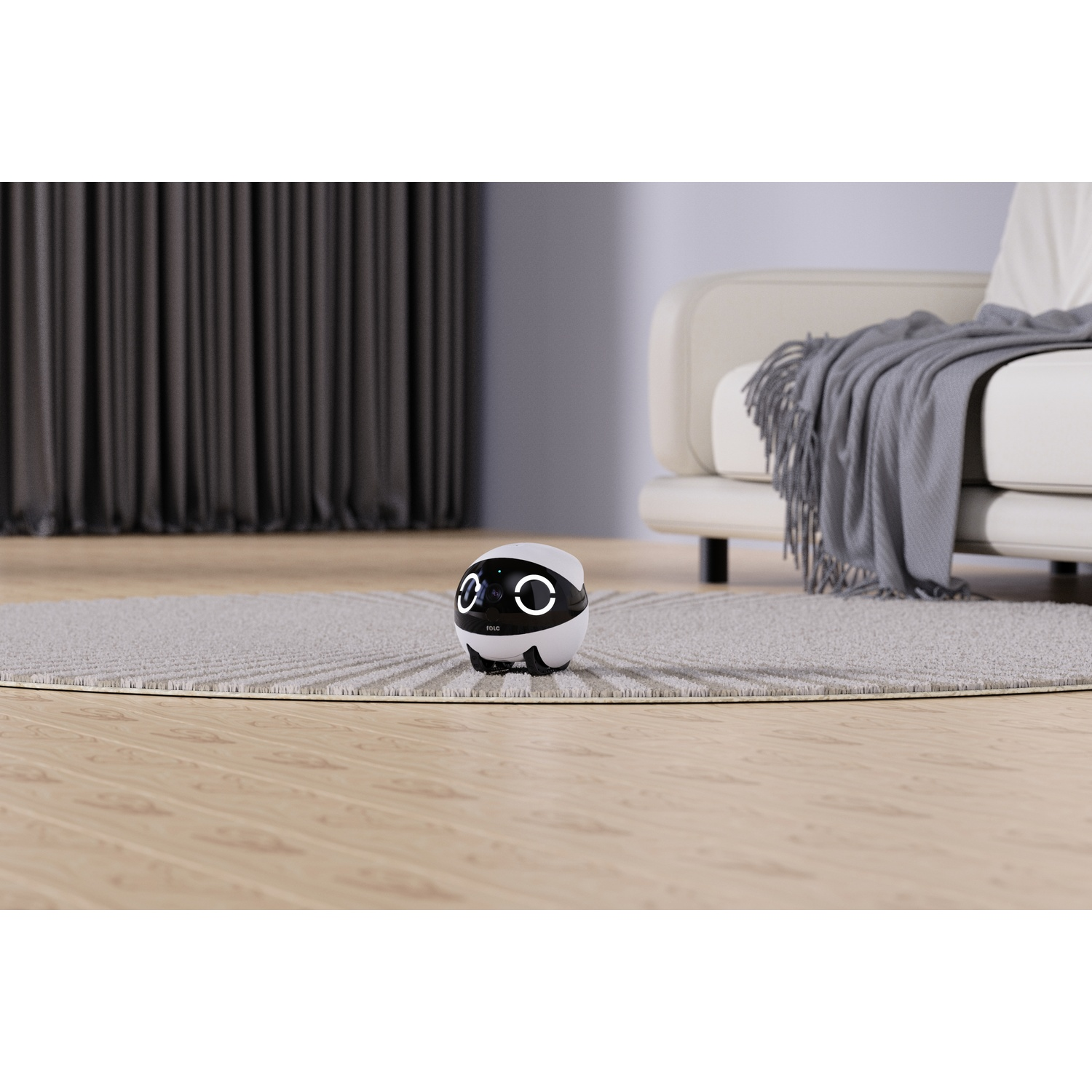 Robot su un tappeto. Divano, coperta grigia e finestra sullo sfondo.