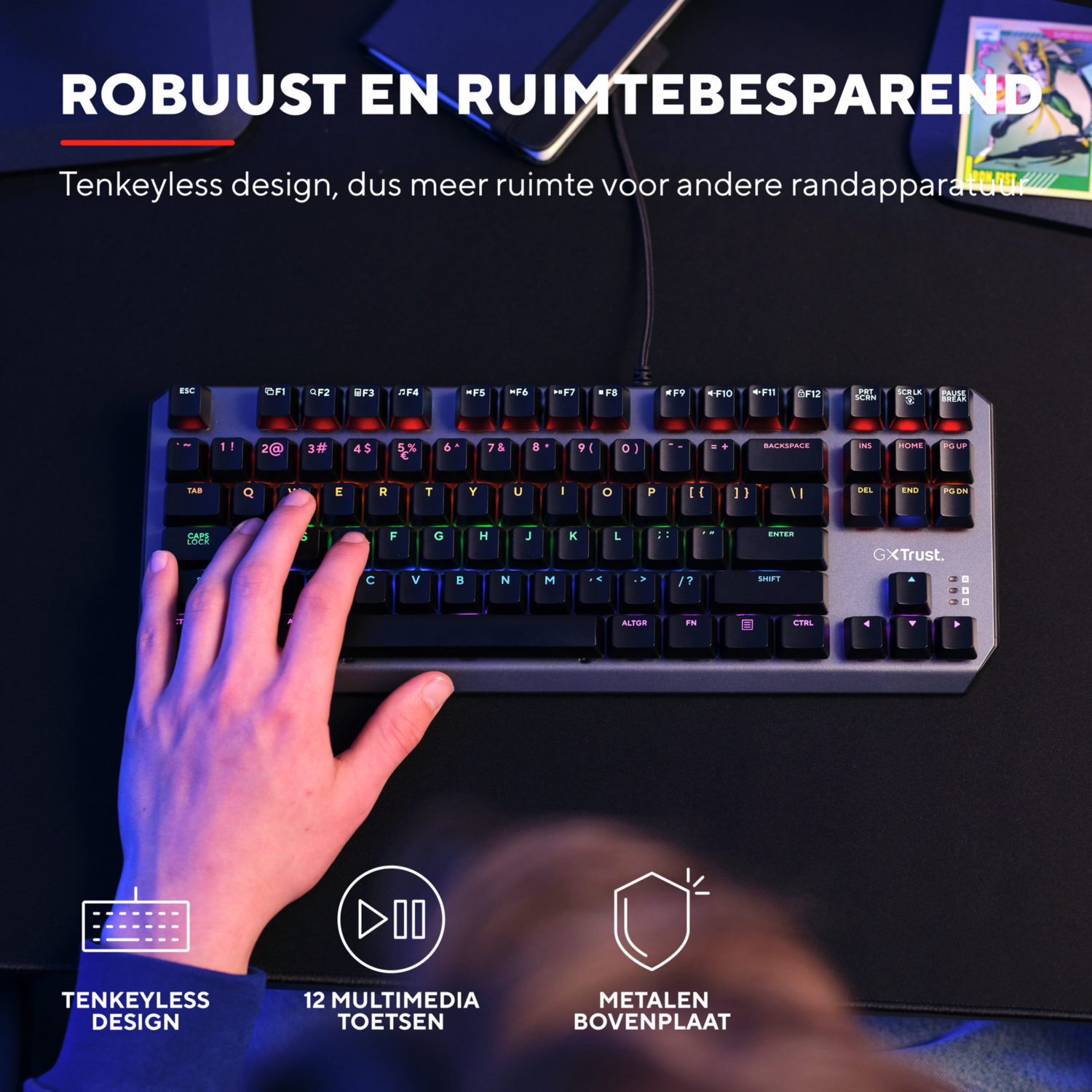 Hand on a keyboard with illuminated keys.
