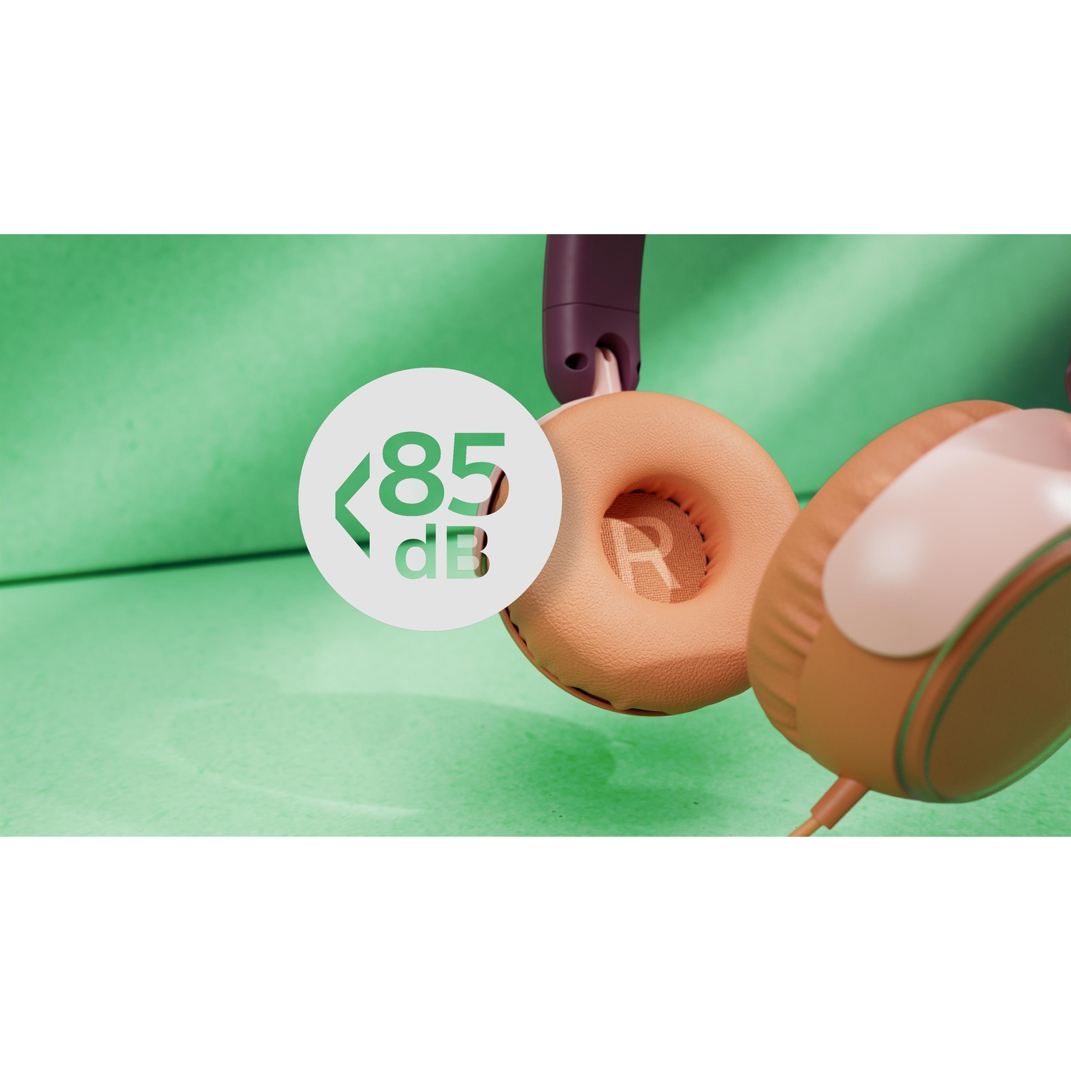 Primo piano di cuffie su sfondo verde. Livello di rumore: 85dB. Padiglioni marroni e rosa.