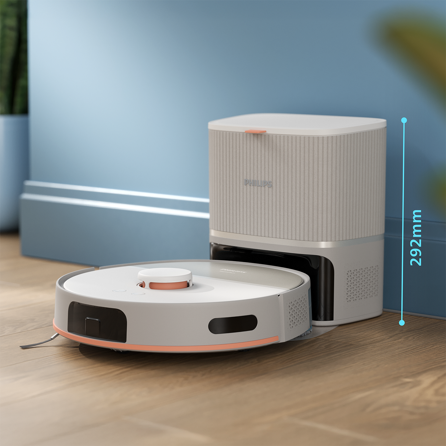 Fehér és szürke Philips robotporszívó töltőállomással. Fa padló és kék fal.