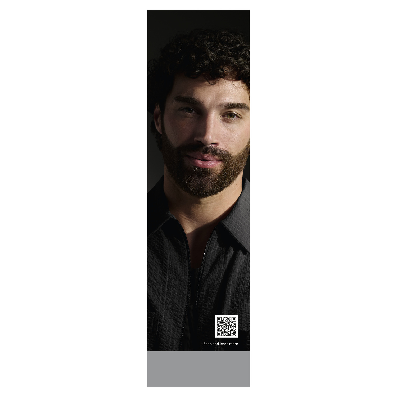 Man with beard, in a black shirt, with a QR code at the bottom.
