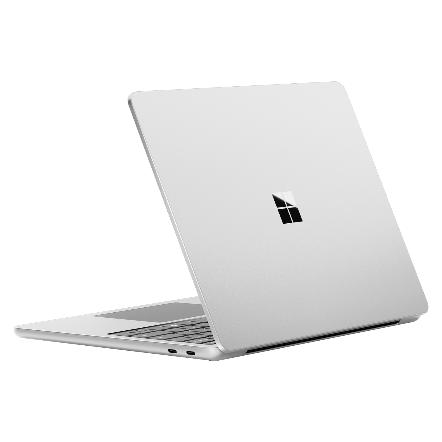 Laptop plateado, vista trasera, cerrado, fondo negro, logo Microsoft.