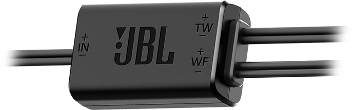 Filtre de croisement audio JBL noir avec fils. Possède des étiquettes d'entrée et de sortie, et le logo JBL est visible. La forme est rectangulaire.