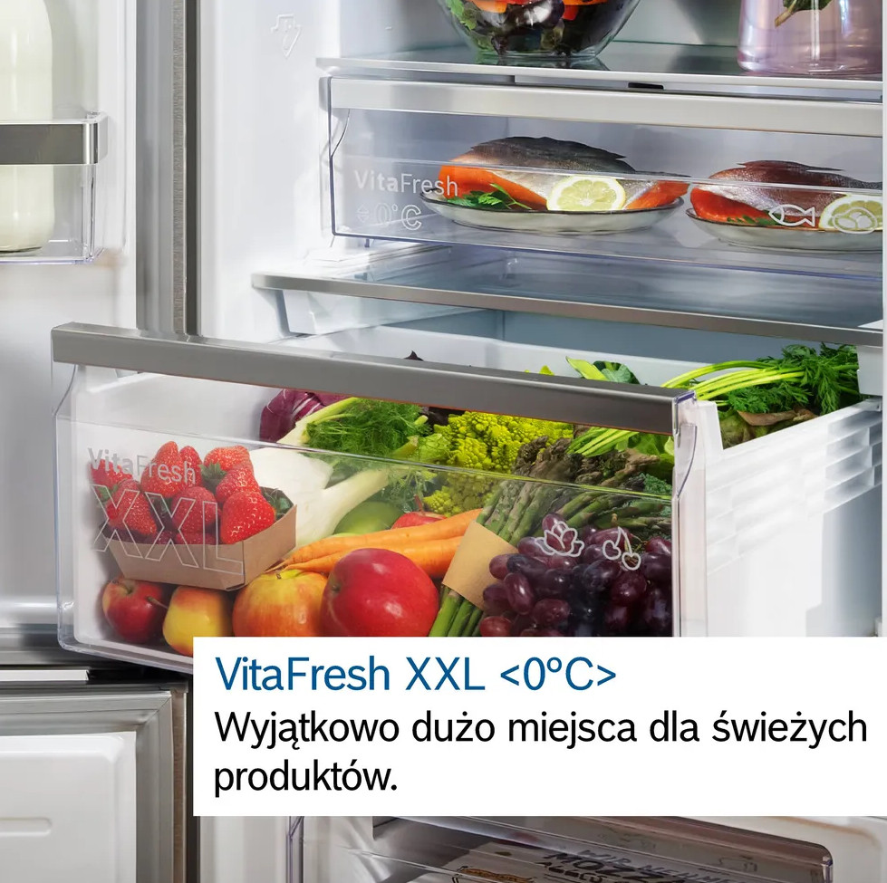 Lodówka z komorą VitaFresh XXL. Zawiera świeże produkty. Tekst nakładki podkreśla funkcję.