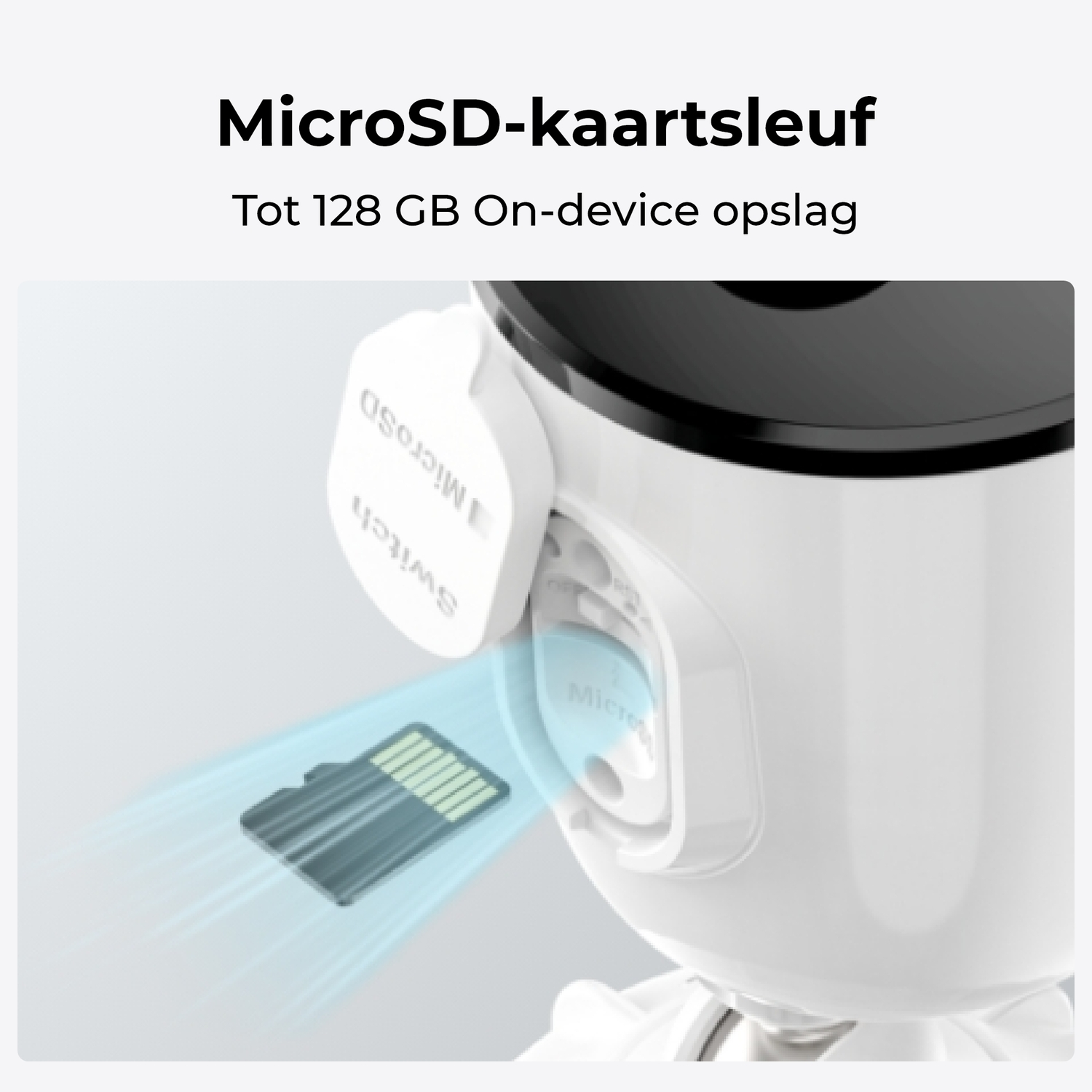 Close-up of a security camera. A MicroSD card is being inserted into the slot.