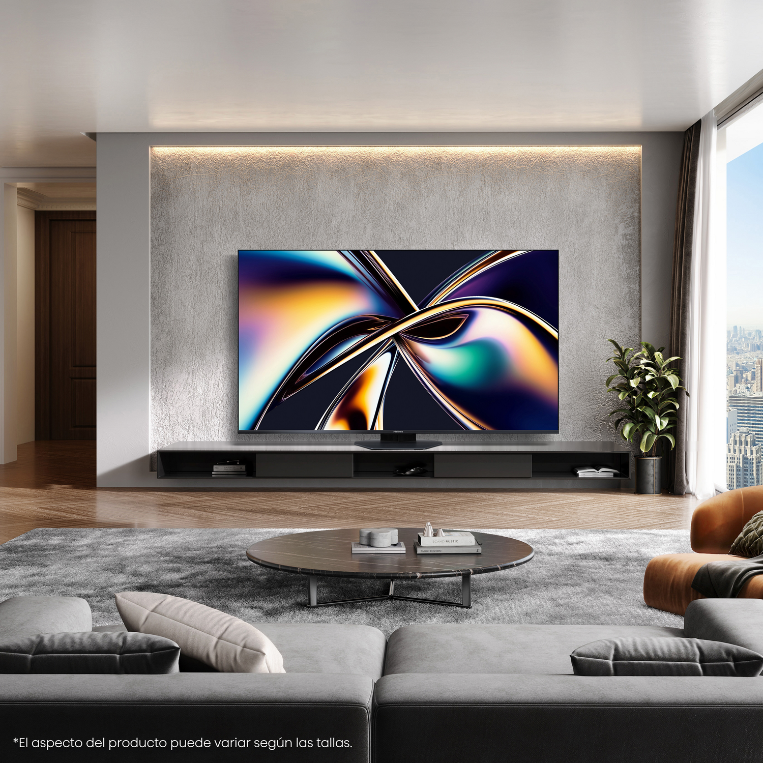 Un salón con un televisor grande en la pared, un sofá y una mesa de centro.