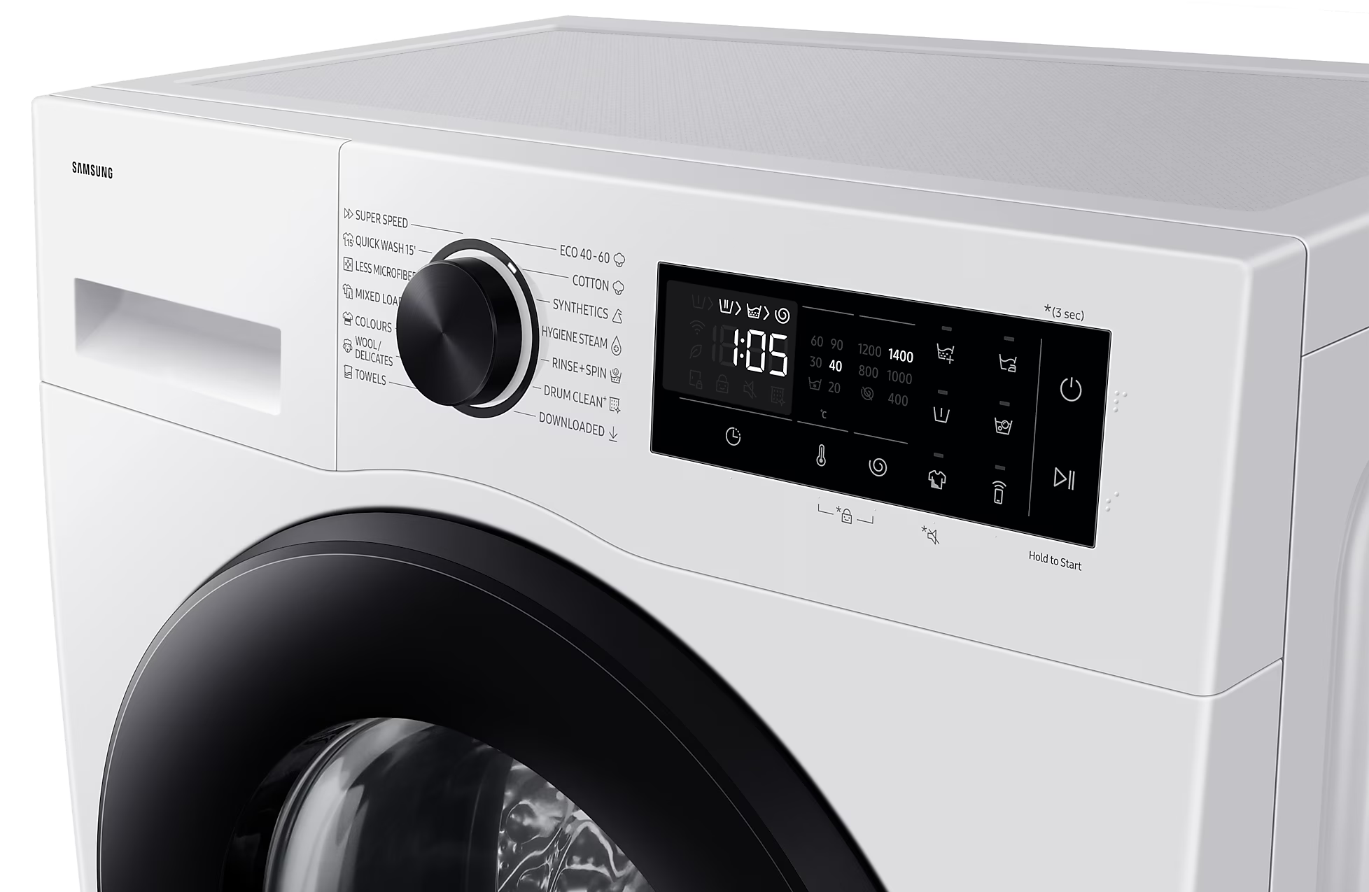 Közelkép a fehér mosógép vezérlőiről, fekete tárcsa, kijelző és gombok.