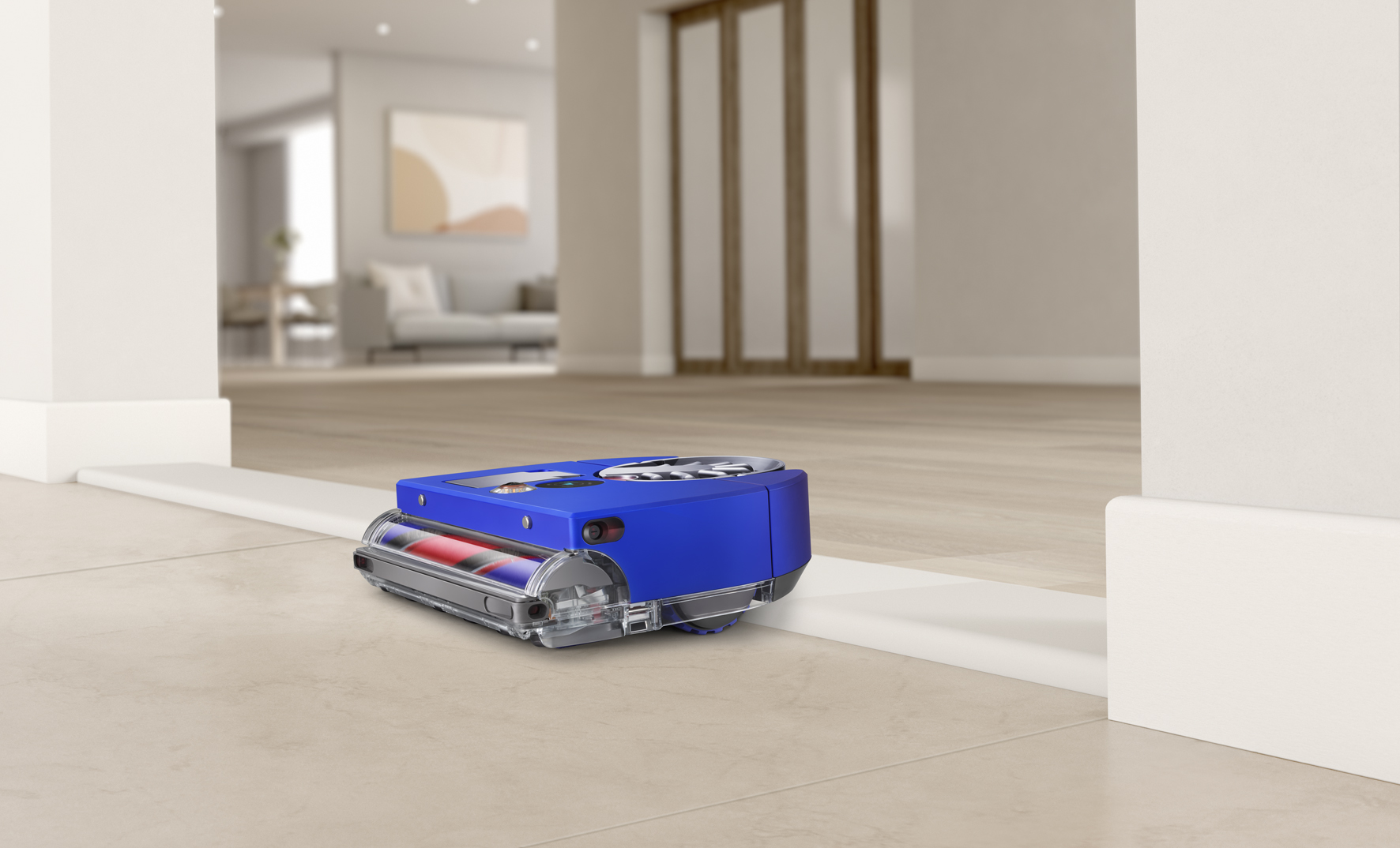 Kék robot porszívó küszöböt tisztít.