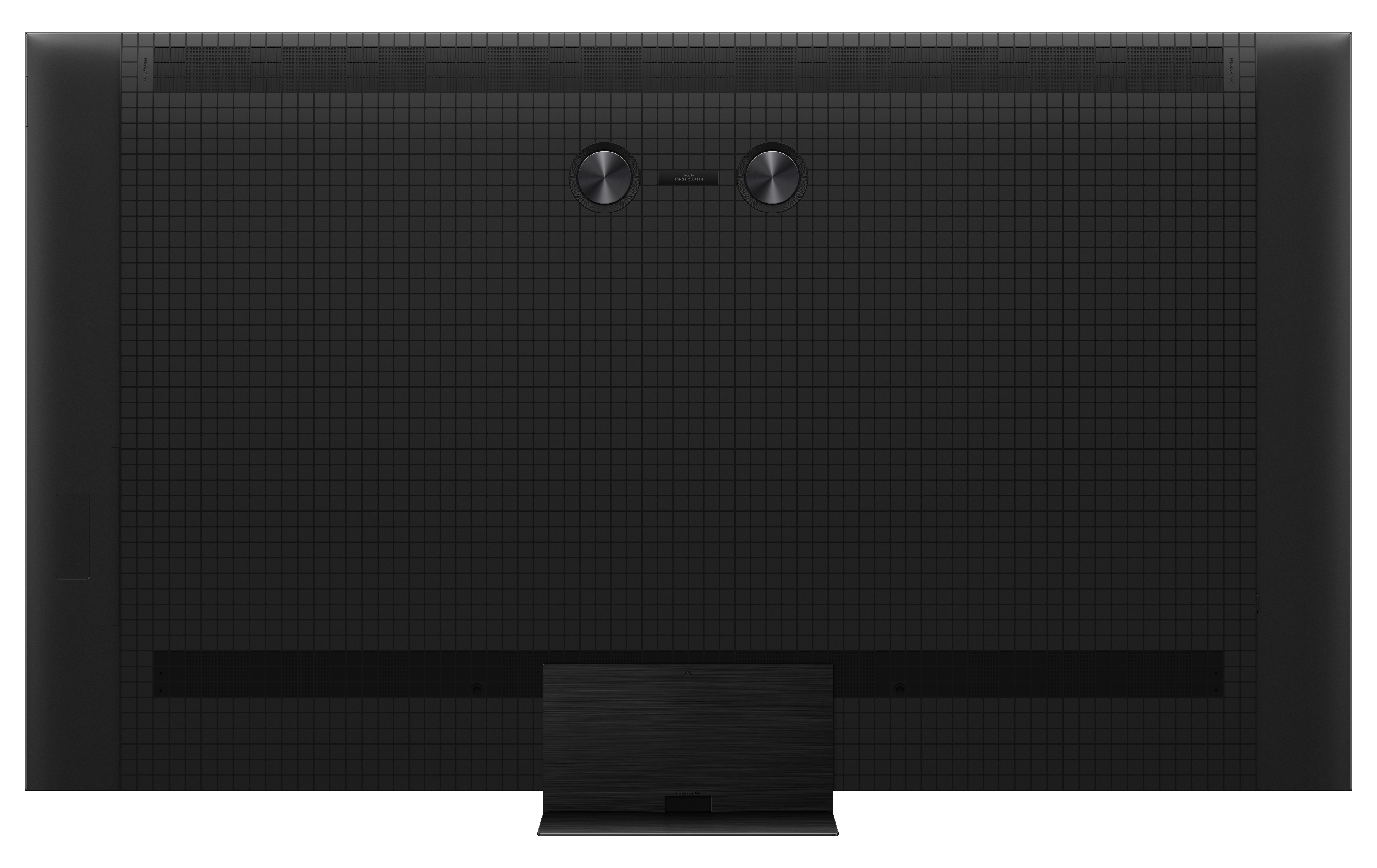 Vista posteriore di una TV nera con supporto, che mostra griglie altoparlanti e porte.