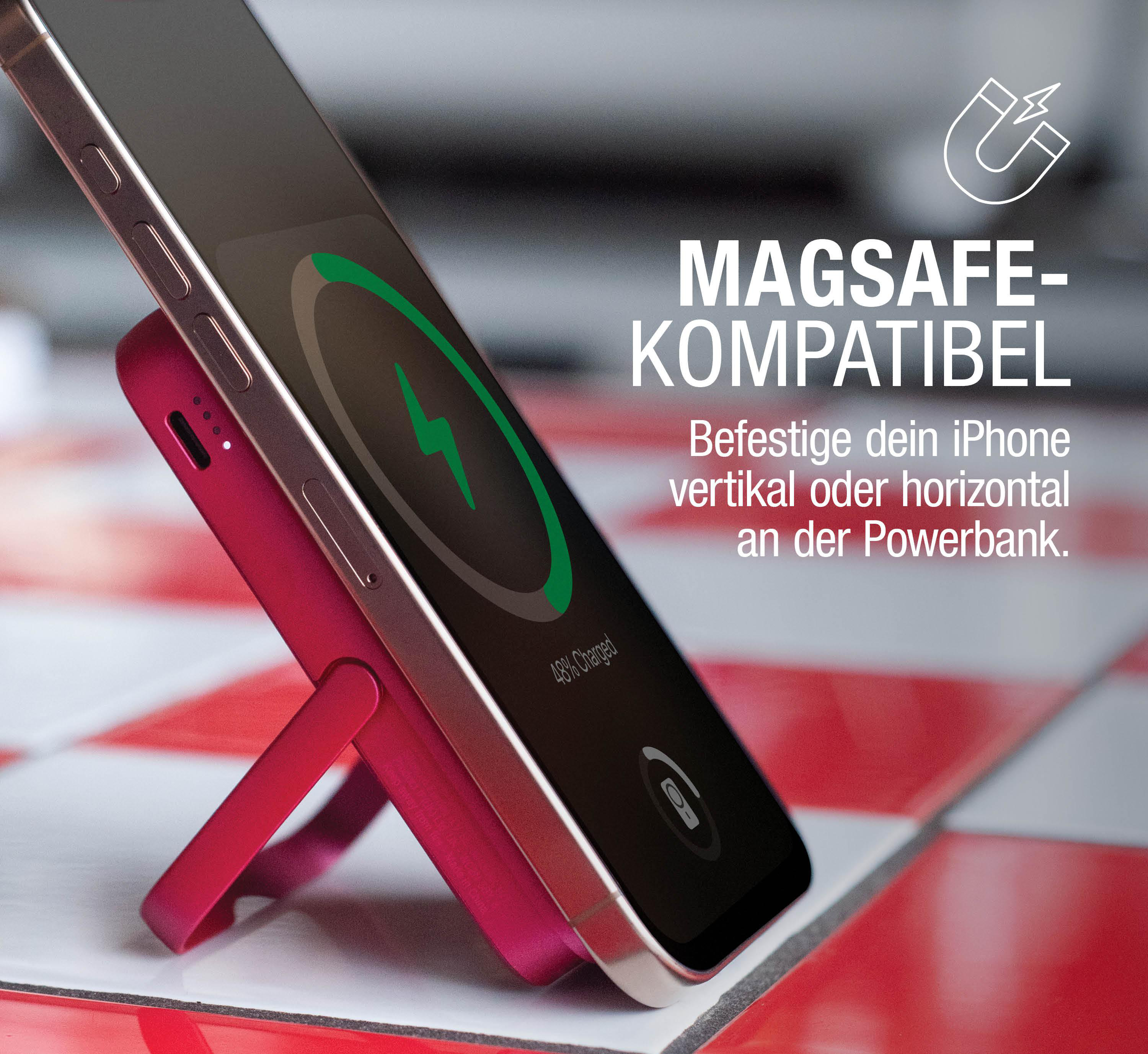 Ein rotes kabelloses Ladegerät mit angeschlossenem Telefon. Das Telefon wird geladen. Das Ladegerät hat einen Ständer.