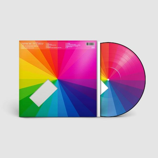 Albumcover und Vinyl-Schallplatte. Regenbogen-Design, das von einem zentralen Punkt ausgeht.