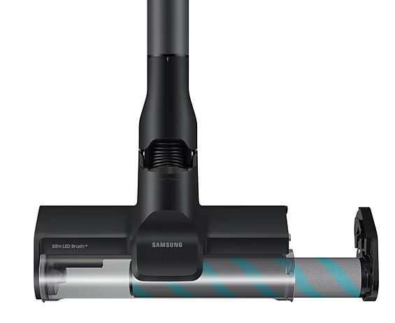 Zbliżenie czarnej głowicy odkurzacza, pokazujące wewnętrzny wałek i szczotkę.