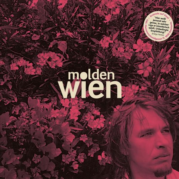 Albumcover: Molden Wien, mit Nahaufnahme eines Mannes vor rosa floralem Hintergrund.