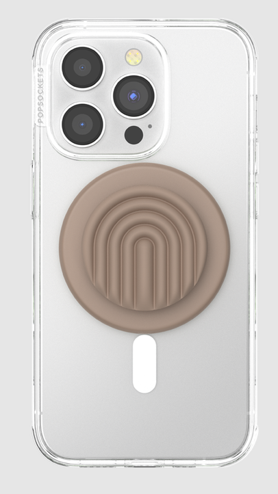 Ein Telefon mit durchsichtiger Hülle und befestigtem hellbraunen PopSockets-Griff, auf hellgrauem Hintergrund.