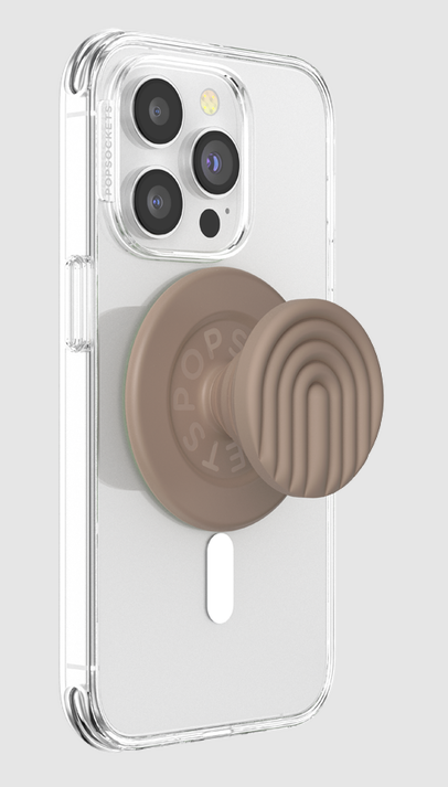 Ein Telefon mit durchsichtiger Hülle und befestigtem hellbraunen PopSockets-Griff, auf hellgrauem Hintergrund.