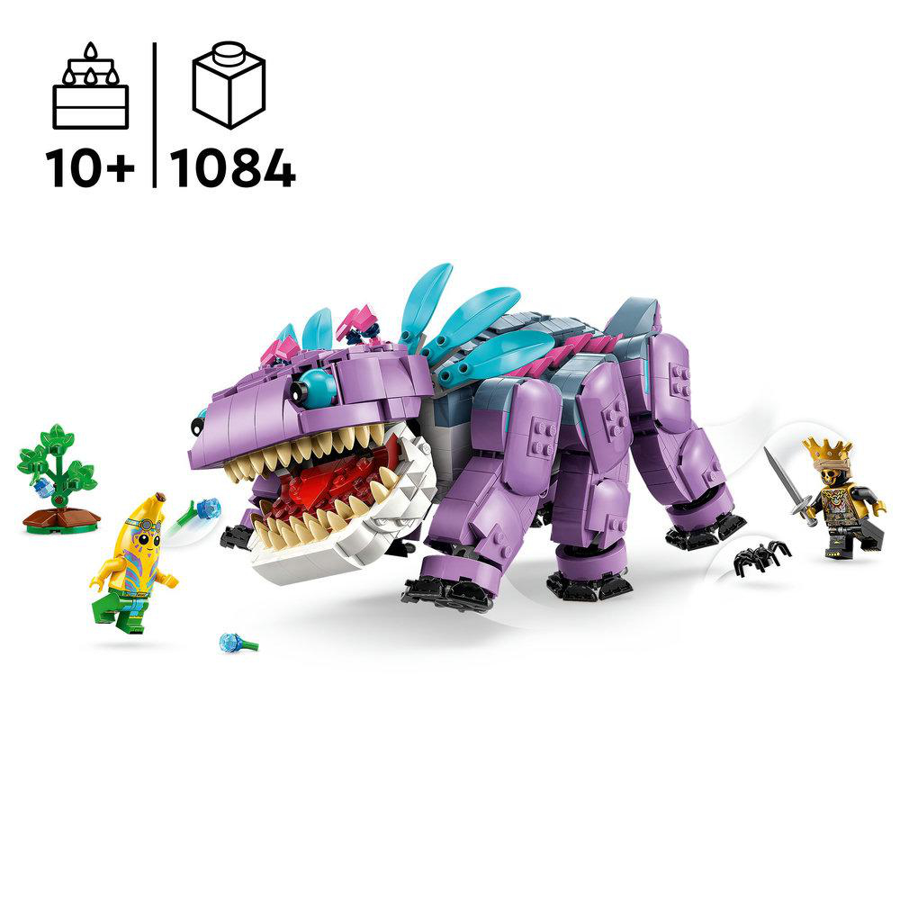 LEGO-Set mit lila Dinosaurier, Minifiguren, Bananenfigur und einer Spinne. Die Box zeigt Alter und Stückzahl.