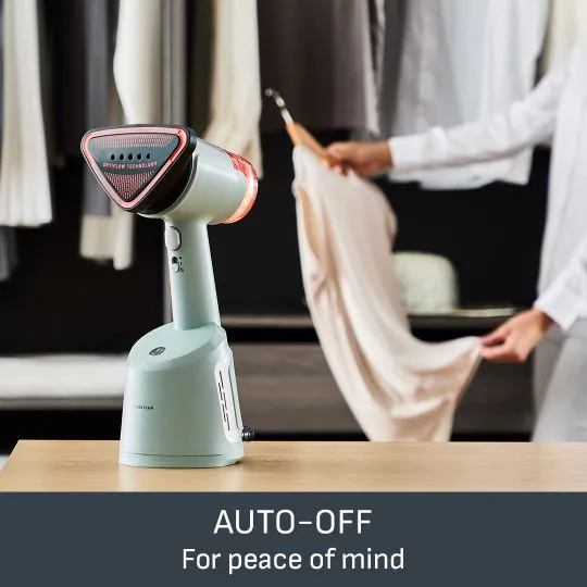 Un vaporizzatore Tefal su un tavolo. Il testo dice: SPEGNIMENTO AUTOMATICO Per la tranquillità.