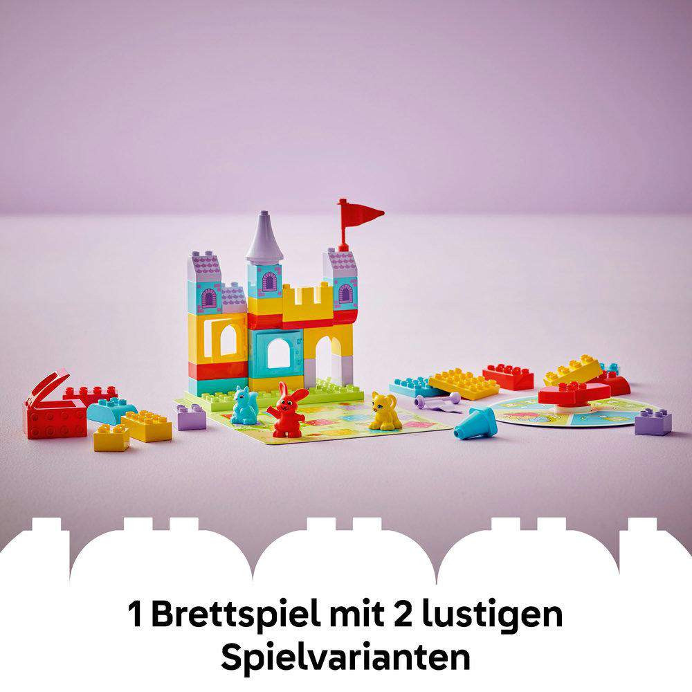 Lego Duplo Burg Set mit Burg, Figuren und Spielsteinen. Rosa Hintergrund.