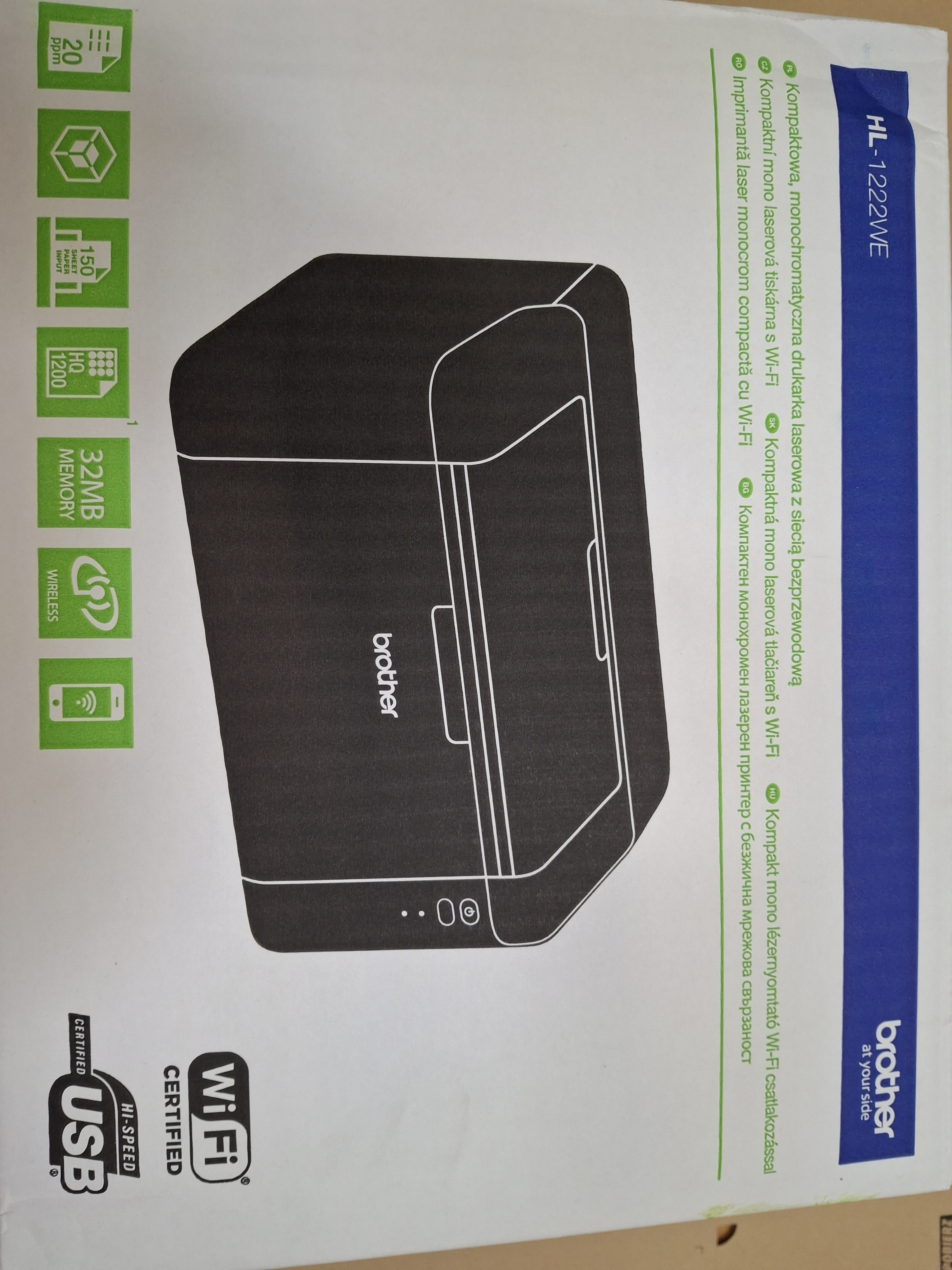 Pudełko z czarną drukarką Brother. Pudełko ma zielone ikony funkcji, takich jak Wi-Fi i USB.