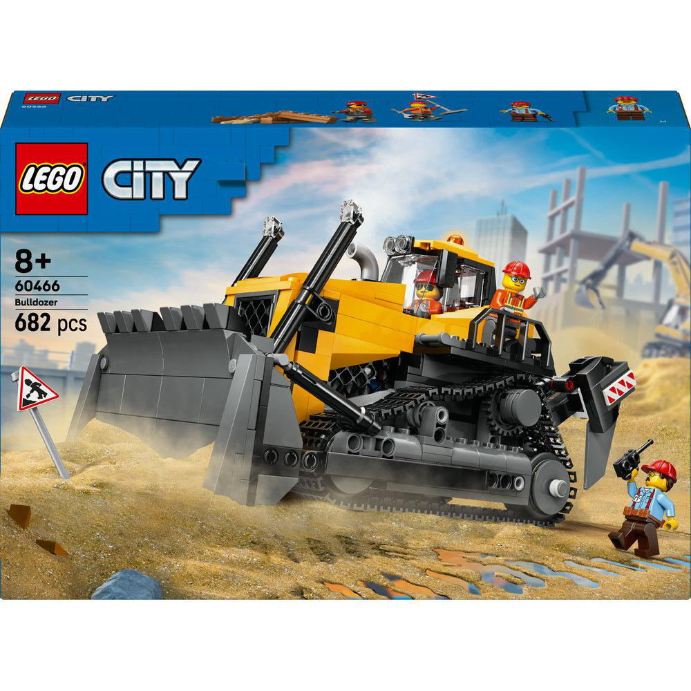 Lego City Bulldozer-Set. Gelber und grauer Bulldozer, Mini-Figuren, Sand und ein Schild. Bauarbeiten im Hintergrund.