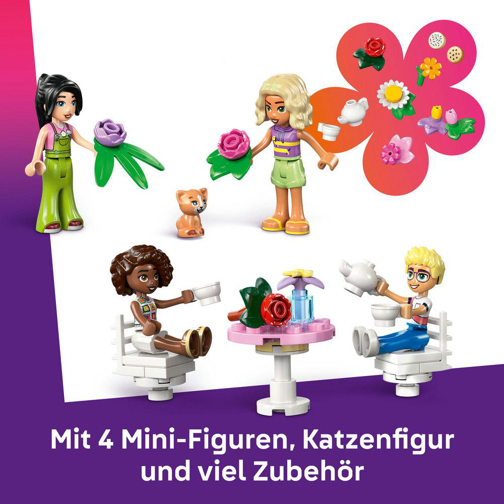 Ein Lego-Set mit Figuren, Katze und Tisch. Blumen und Gegenstände sind auf dem Tisch.