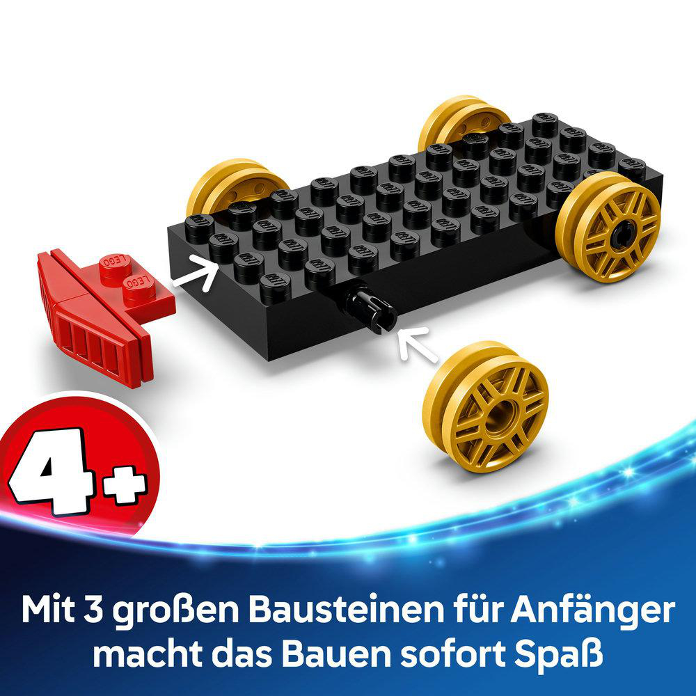 Nahaufnahme von Lego-Rädern und rotem Teil, die zeigen, wie man sie mit einem schwarzen Stein verbindet.