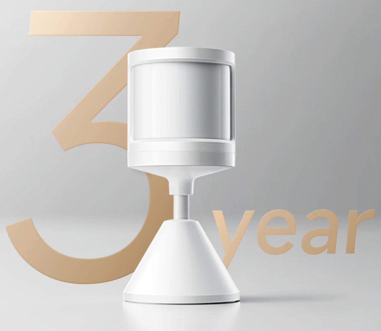 Białe cylindryczne urządzenie ze złotą '3' i tekstem 'year' na jasnoszarym tle.