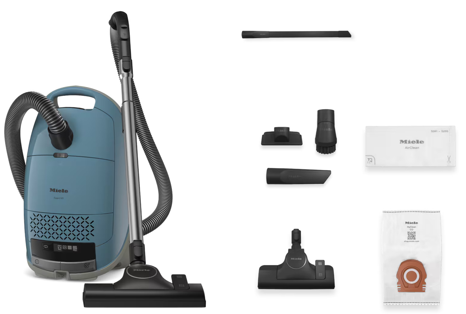 Odkurzacz Miele z akcesoriami. Zawiera różne dysze i worki na kurz. Białe tło.